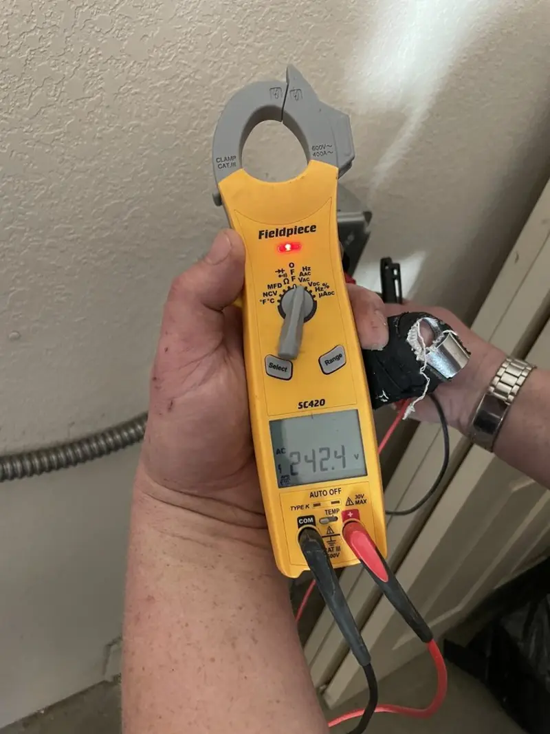 Voltage testing with clamp meter during Outlet Installation in Scissors
